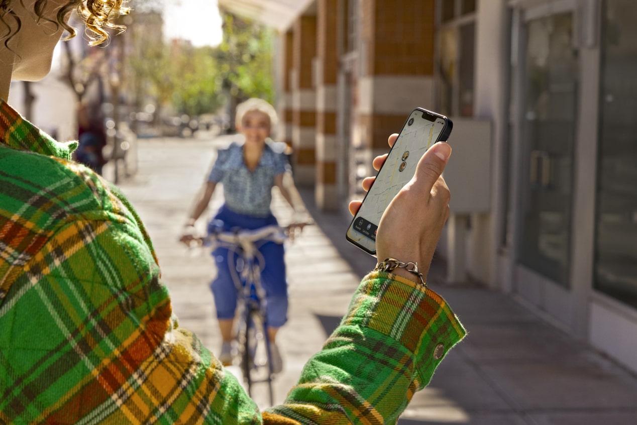 Someone Checking Their Phone While Biker Approaches