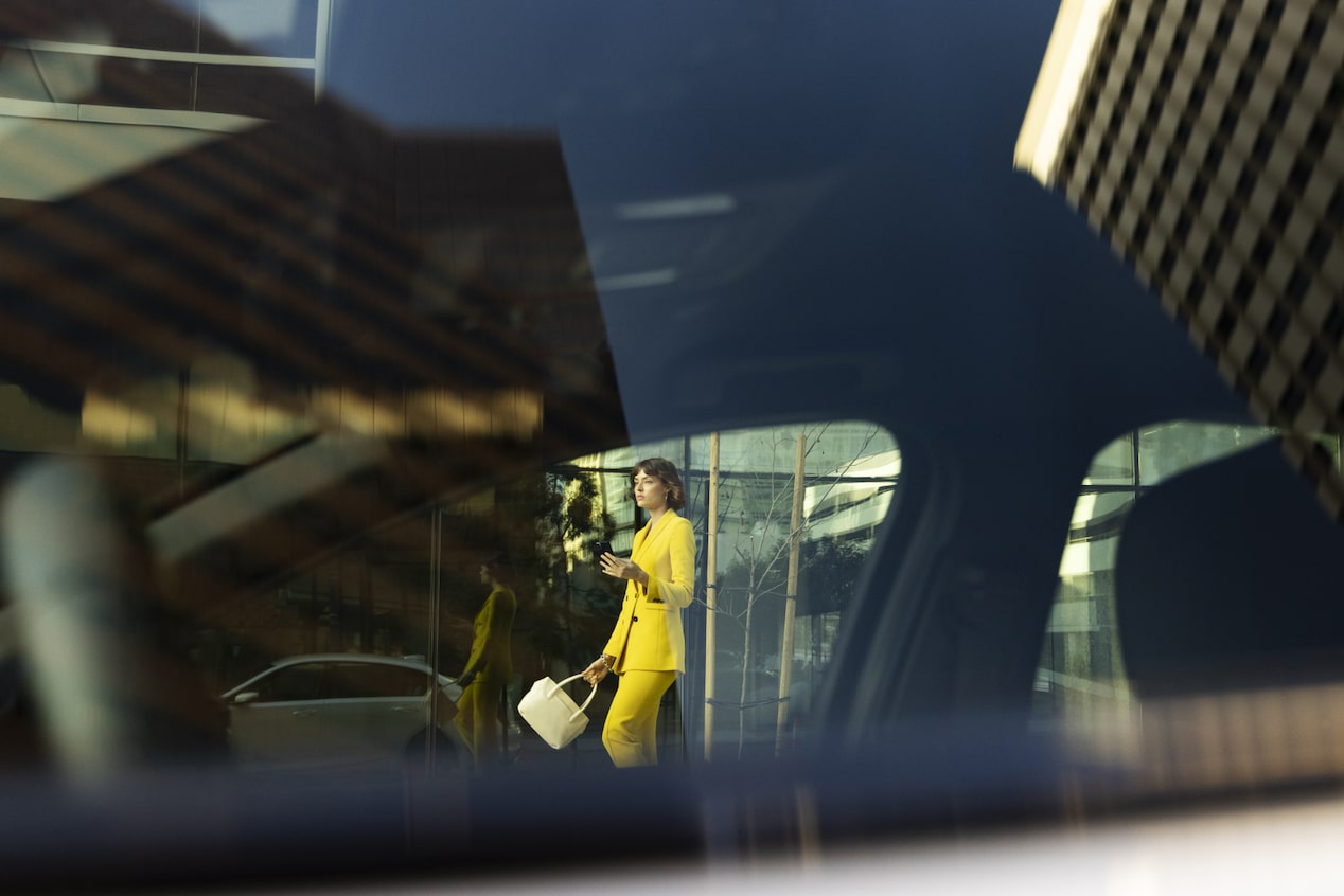 View Through a Car Window of a Woman Walking