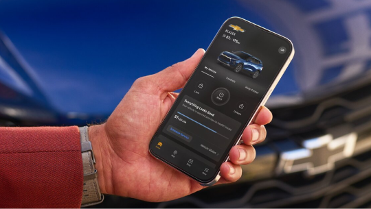 Close up of a customer using the myChevrolet app on a smartphone