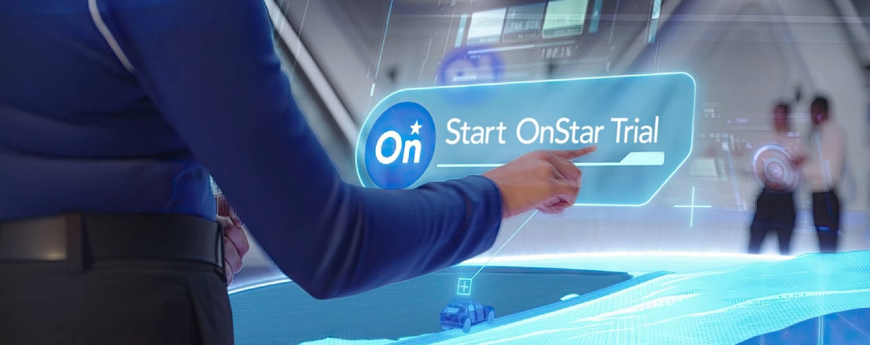  A woman pushing the start OnStar trial button