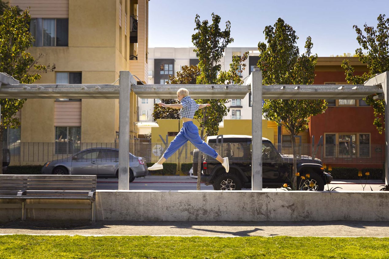 Woman Jumping in a Downtown Setting 