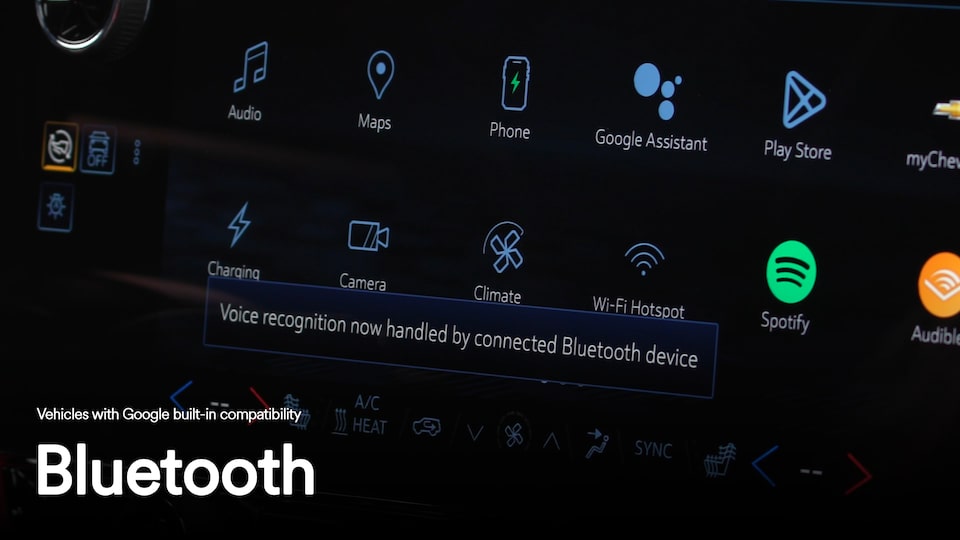 Close-up of the infotainment screen displaying a song playing with text overlay "Bluetooth"