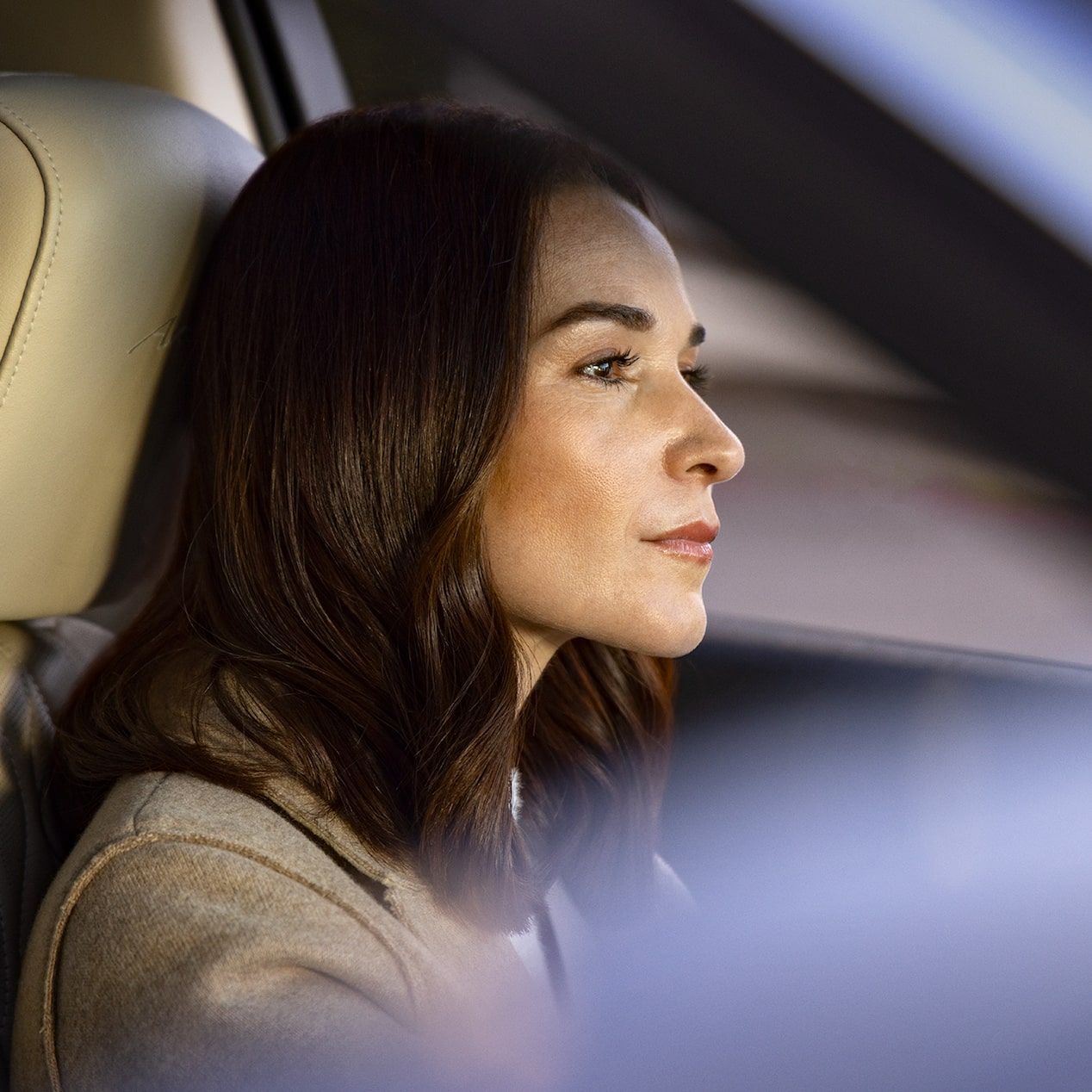 A Close up View of a Woman Very Focused While Driving