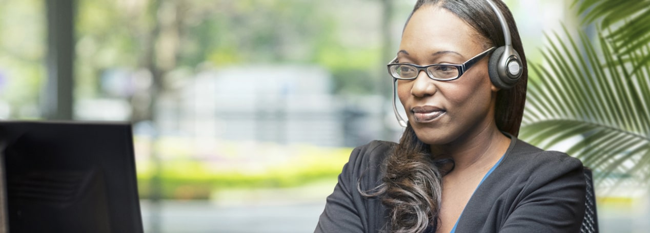 OnStar Advisor Typing on Her Computer & Ready to Assist