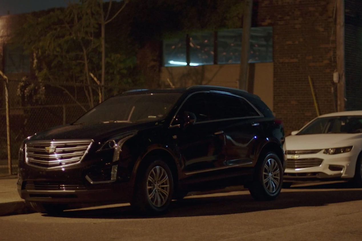 vehicle parked on the side of the road at night