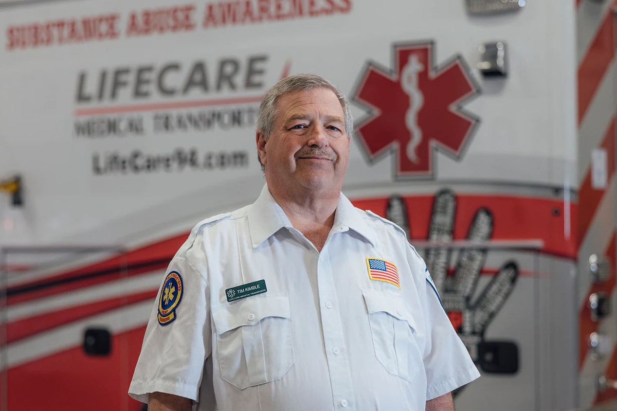 First Responder Timothy K Standing Infront of Ambulance 