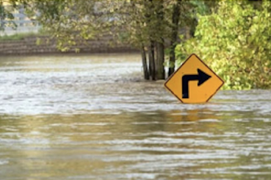 Right-Turn Road Sign Almost Covered By a Bad Flood