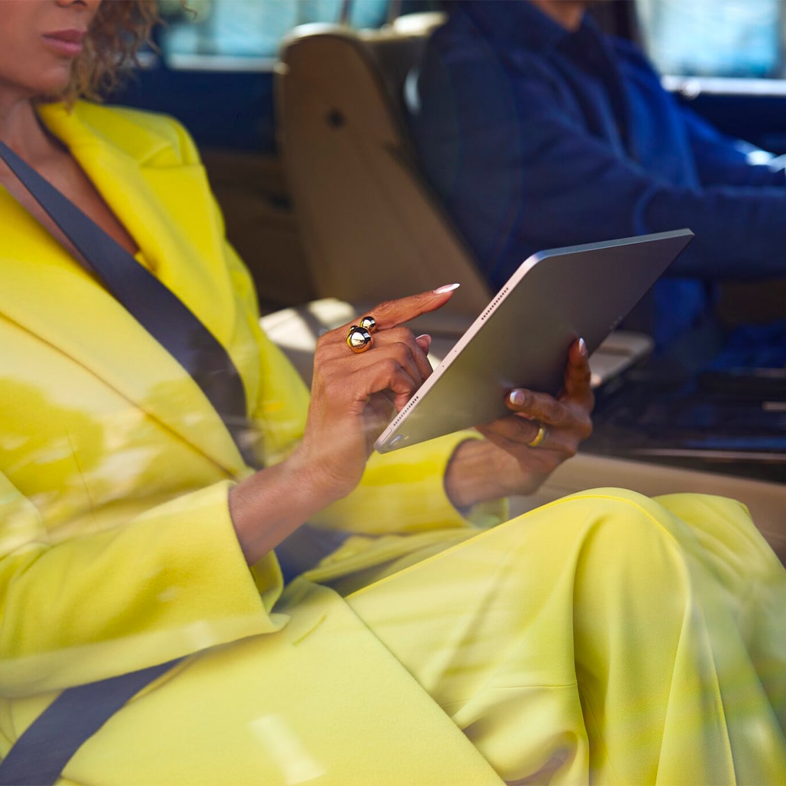 A woman using the Super Cruise feature in her GM vehicle.