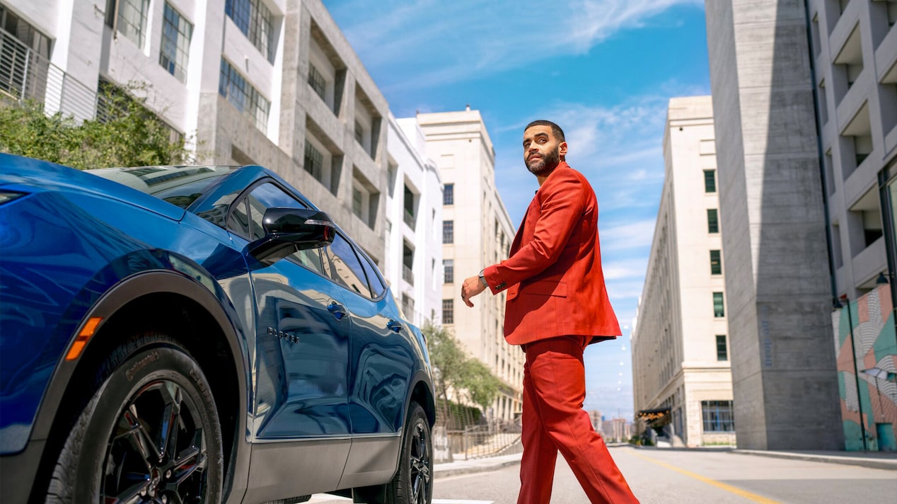 A person walks to their car.