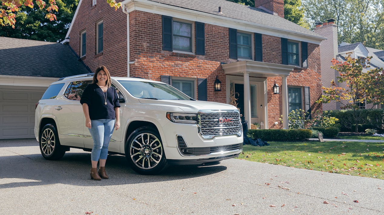 Ashlee McKinley Standing Next to Her GMC Vehicle