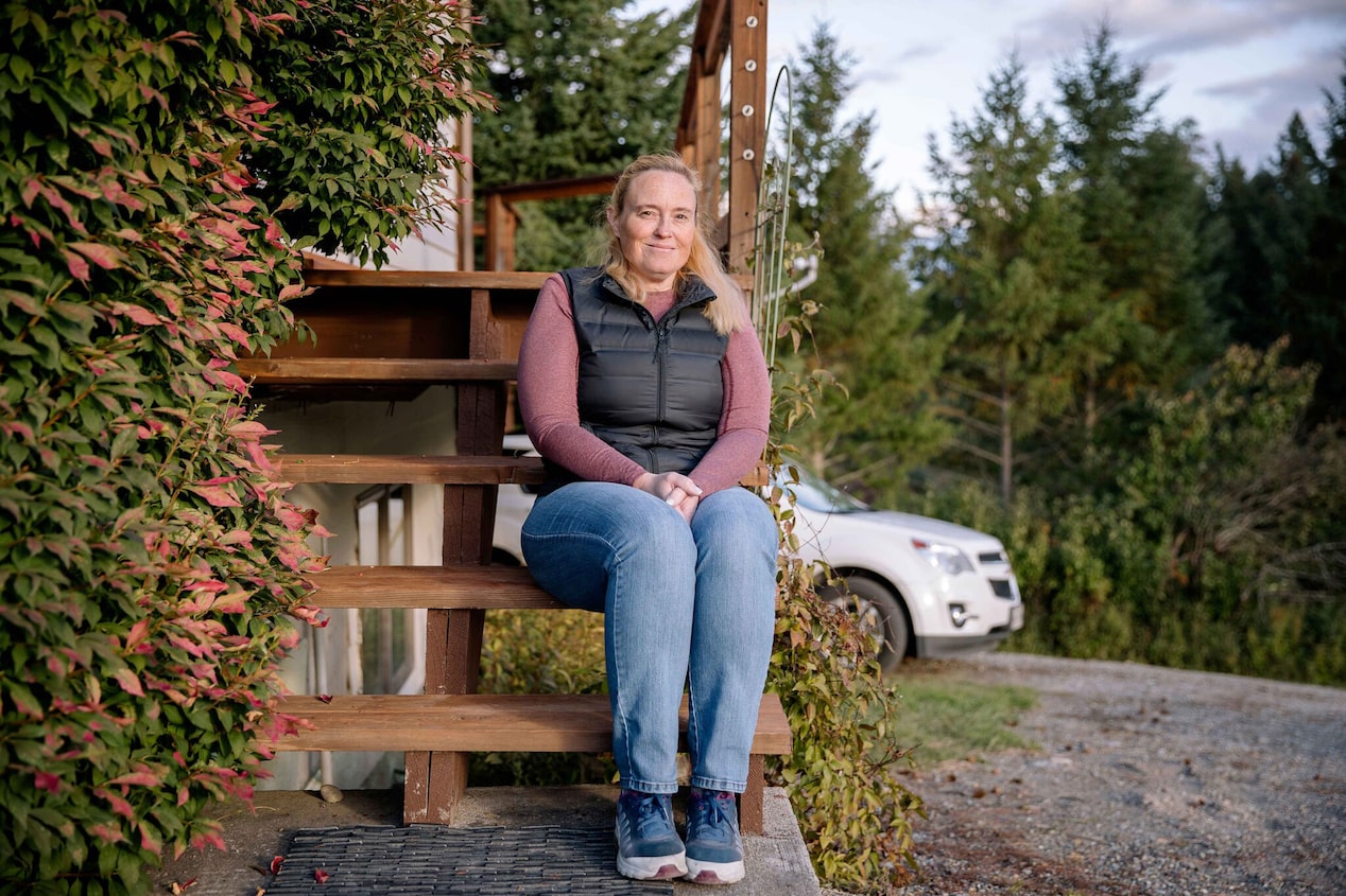 Women Sitting on Front Door Steps Smiling