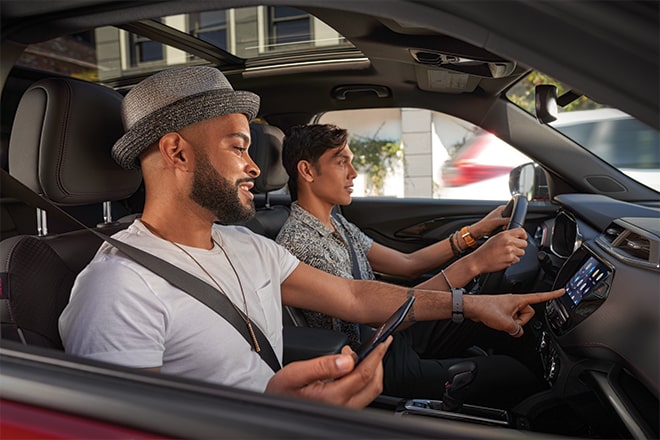 View From the Passenger Side Window of Two Men in a Vehicle