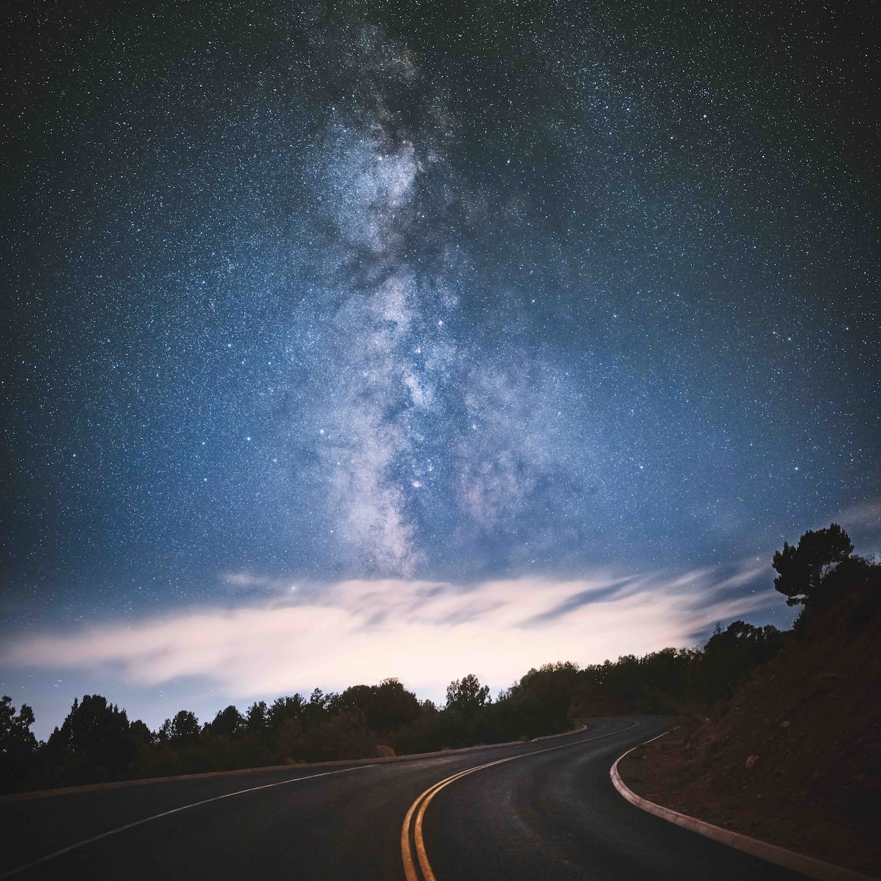 Open Road with a Starry Night Sky