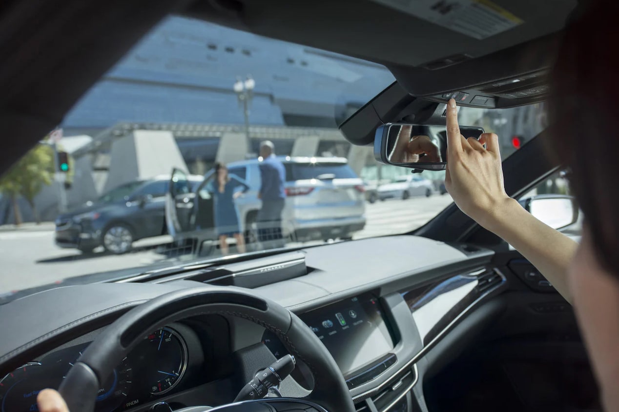 Driver Pressing the OnStar Butten in GM Vehicle 