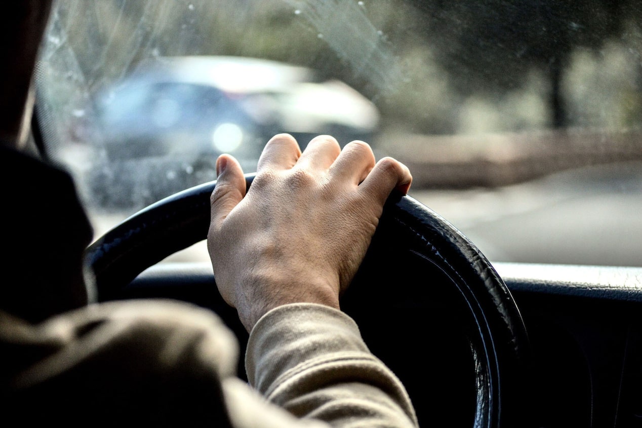 Hand on Steering Wheel