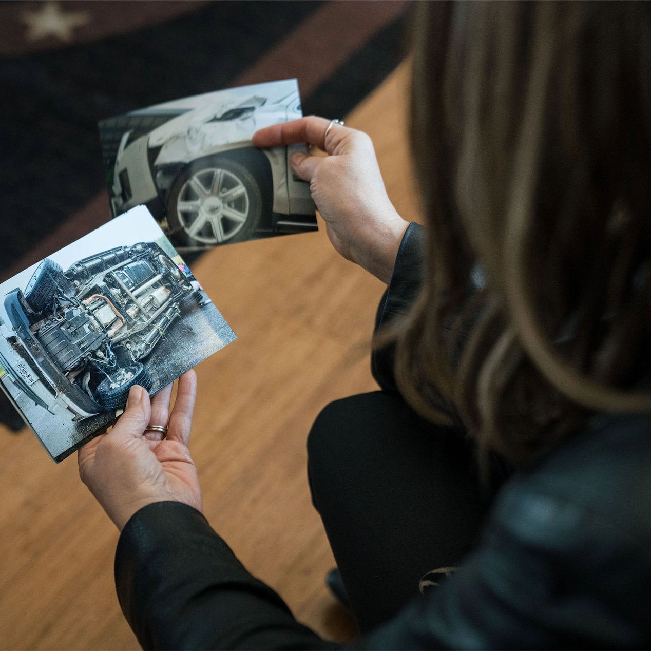 Woman Looking at Pictures of Vehicle