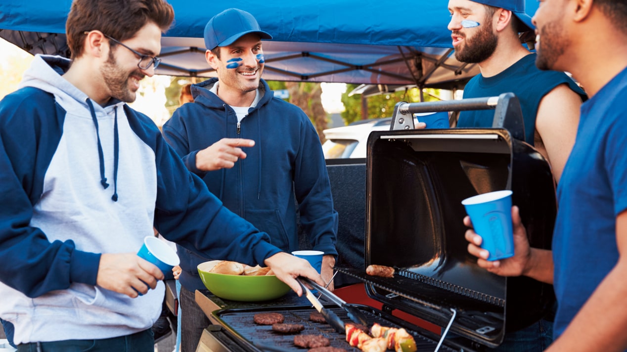 Group of Men Grilling and Wearing Gameday Gear