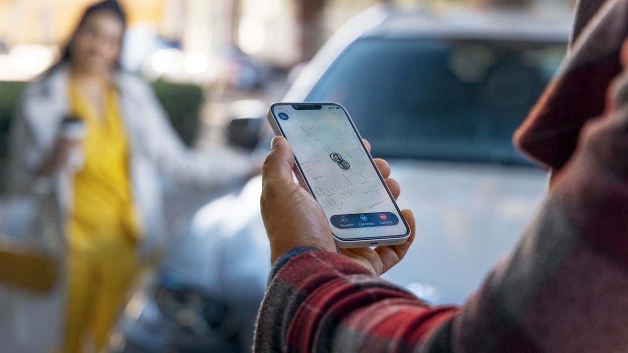 Close Up of Customer Using the OnStar Guardian App