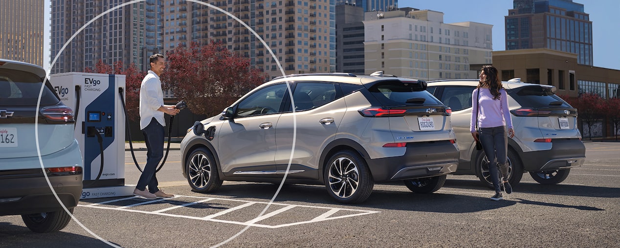 People in Professional Clothing Checking out the Chevy Bolt