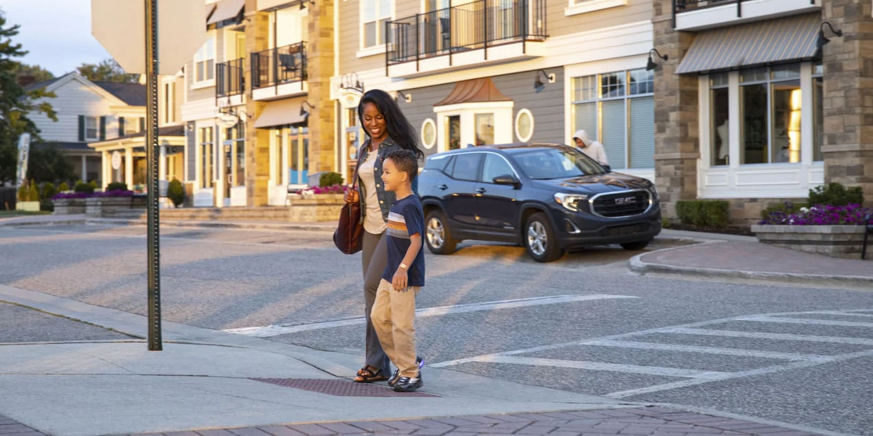 Mother and Son Finishing Crossing a Cute Town Street