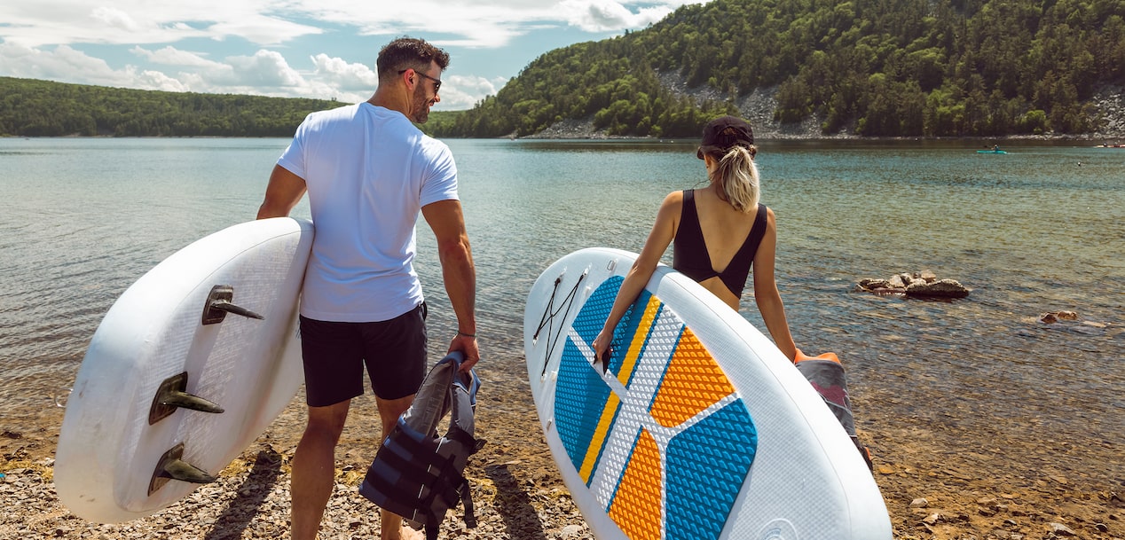 Couple Enters Clear Lake With Paddleboards