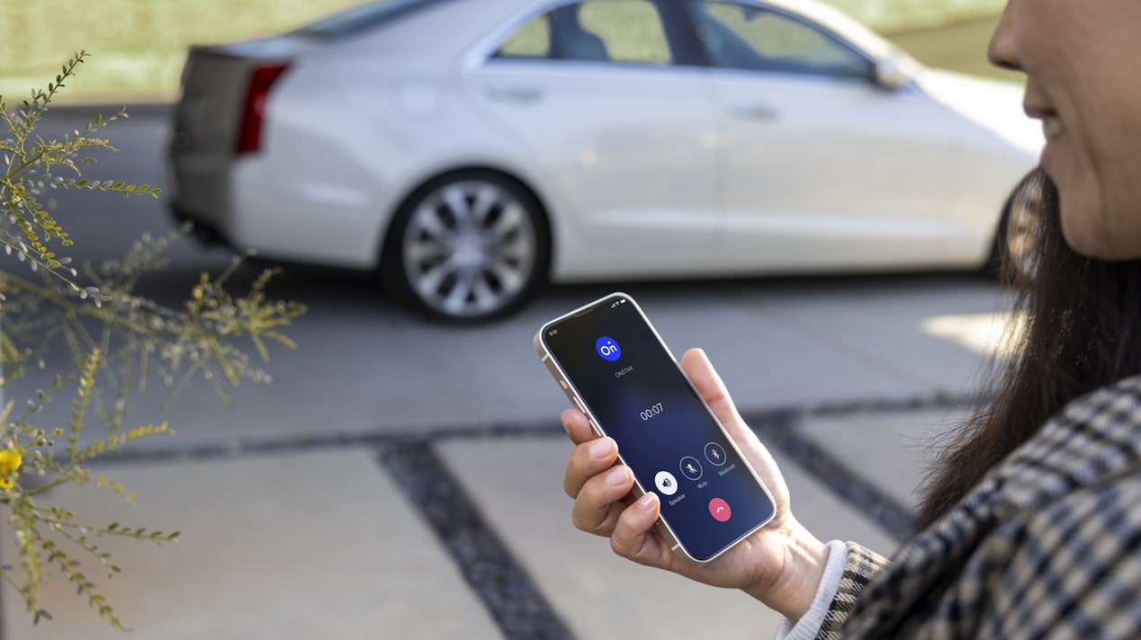 Close-Up of Hand Holding a Smartphone Showing That a Call is Being Placed to OnStar