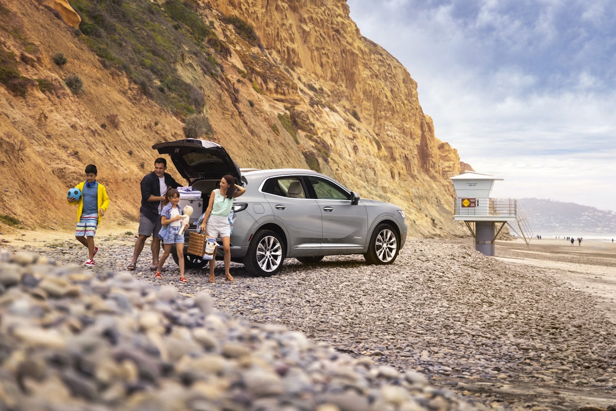 Family At the Beach Unpacking Their GM SUV