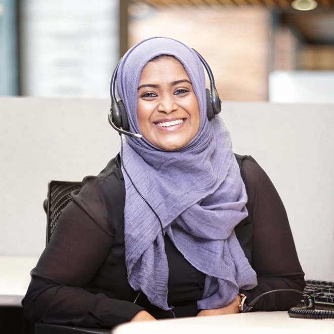 Female OnStar Advisor Smiling with Headset on